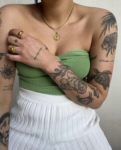 a woman with many tattoos on her arm