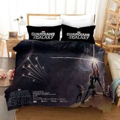 a bed with two pillows on top of it and an image of the characters from star wars