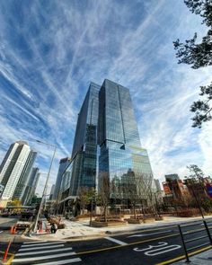 a very tall building sitting on the side of a road