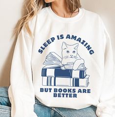 Sleep is amazing but books are better. Perfect for every book lover who knows the joy of getting lost in a good book. Whether you're gifting it to a fellow bookworm or treating yourself, it's the perfect way to express your passion for books.  *This sweatshirt is printed in the United States* *Made from 50% Cotton and 50% Polyester* Our sweatshirts are unisex. Please refer to the size chart in the picture for sizing.  For sweatshirt care, we recommend that you machine wash: warm; non-chlorine bl White Bookish Sweatshirt With Letter Print, Reading Sweatshirt, Bookworm Gifts, Bookish Things, Best Novels, Club Sweatshirts, Gifts For Bookworms, Book Stuff, Who Knows