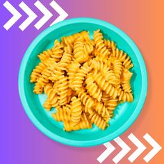 a blue bowl filled with macaroni and cheese on top of a colorful background