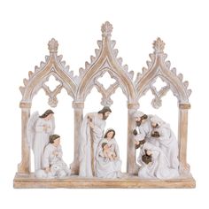 a nativity figurine depicting the birth of jesus and his family, in white marble