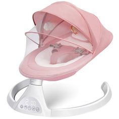 a baby's pink hat is sitting on top of a white stand with the lid open