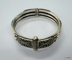 "Traditional design sterling silver bangle bracelet cuff from Rajasthan India. Great handmade design, Good for your jewellery collection. Note - Pictures is part of Description. Please check pictures carefully for more detail. Inner diameter side to side - 5.6 cm (2.2\") Inner circumference - 17.58 cm (6.9\") width max. - 14 mm Weight - 38.5 grams Material - Good sterling silver." Handmade Ornate Sterling Silver Bangle Bracelet, Luxury Bangle With Intricate Design, Silver Bangle Bracelets Cuffs, Note Pictures, Silver Bangle Bracelet, Sterling Silver Bangle Bracelets, Sterling Silver Bangle, Rajasthan India, Bracelet Cuff