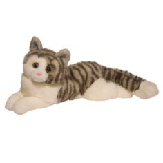 a stuffed cat laying down on the ground