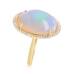 Ross-Simons - Ethiopian Opal, .21ct t. w. Diamond Halo Ring in 14kt Yellow Gold. Size 7. A spellbinding statement of confidence and style. In this ring, an 18x13mm Ethiopian opal oval cabochon wows inside a sparkling halo of .21 ct. t. w. round brilliant-cut diamonds. Crafted in 14kt yellow gold. 7/8" wide. Diamond and Ethiopian opal ring. Opal birthstones are the perfect gift for October birthdays. Opal Ring With Diamond Accents In 14k Gold, 14k Gold Opal Ring With Diamond Accents, Formal Opal Ring With Diamond Accents Round Cut, Formal Opal Halo Ring With Round Cut, Formal Halo Opal Ring With Round Cut, Formal Round Cut Halo Opal Ring, Formal 14k Stamped Halo Ring, Stamped 14k Gold Halo Ring For Formal Occasions, Formal Opal Halo Ring