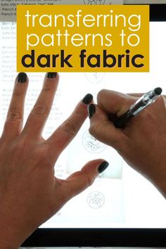 two hands with black nail polish on their fingers and the text transfering patterns to dark fabric