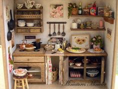 an old fashioned kitchen with pots and pans