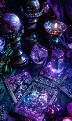 some cards and candles on a table with purple lights in the background, including one that appears to be playing tarot