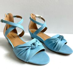 This Pair Of Comfortview Austen Sandals Is New In The Box. They Have Not Been Worn, Only Tried On. They Are A Sky Blue Color. Low Heel Sandal With An Ankle Strap And Adjustable Buckle. Knotted In The Front Which Gives It A Retro, 70s, Disco Vibe. Straps Cross In The Front. Zipper At Heel For Easy On And Off. All Manmade Materials. Comes In Original Box. Its Only Flaw Is That It Was Stored Near Potpourri Drawer Sachets, So They Smell Like Potpourri. There Is Also Some Wear On Both Shoes By The Zi Tie Sandals, Low Heel Sandals, Strappy Sandals Heels, Gold Sandals, Swim Shoes, Espadrille Sandals, Slingback Sandal, Strappy Sandals, Low Heels