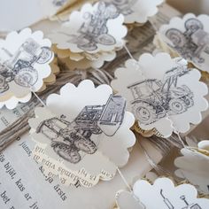 some paper tags with pictures of tractors on them