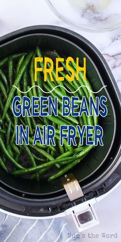 fresh green beans in an air fryer with the words, fresh green beans in air fryer