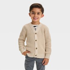 Update your toddler's knitwear with this Cardigan Sweater from Cat & Jack™. Made from a midweight cotton-recycled polyester blend, this cream-color cardigan showcases a waffle-knit design with a full-length button-down front for easy layering. The V-neckline, long sleeves and ribbed edges complete the design, blending comfort with sweet style. Cat & Jack™: Designed for all children so you can trust it's made for yours. Picture Day Outfit, Toddler Cardigan, Picture Day Outfits, Cream Colored Cardigan, Boys Cardigans, Henley Sweater, Target Clothes, Picture Day, Embroidered Sweater