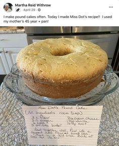 a cake sitting on top of a glass platter next to a note that says martha friedthrow