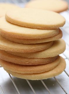 a stack of cookies sitting on top of a cooling rack