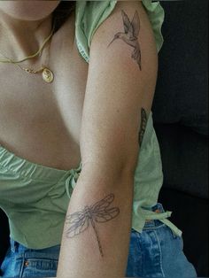 a woman with a tattoo on her arm