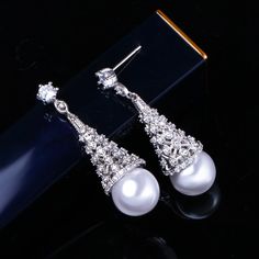 CZ Jewelry- Elegant Women Simulated Pearl Jewelry For Party Gift Big Crystal Stone Paved Silver Color Long Dangle Drop Earrings Model Number:32882237302 Earrings Size : 4.2 cm Brand : Pera Jewelry Item Type : Luxury Women Party Earrings For Gift Material : Cubic Zirconia Main Colors : White Earrings Model, Jewelry Elegant, Party Earrings, Cz Jewelry, Women Party, Big Earrings, Crystal Stone, Ladies Party, Luxury Women