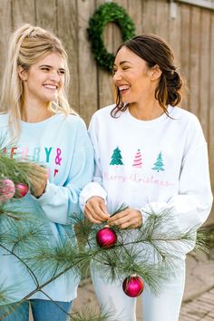 Holiday Restock November 1st! A sweatshirt as white as snow and trees as cute as can be! I love the fun Three Christmas Tree Design! These make great gifts to friends and family (or to gift to yourself, of course)! This design is embroidered on your choice of a light pink or white Crewneck Gildan sweatshirt. It is unisex sized. This means the sizing is boxy, not fitted like women's, but it is not oversized. It is true to size. Specifications: 8 oz.(US) 13.3 oz.(CA), 50/50 preshrunk cotton/polyes Cute White Christmas Sweatshirt, Pink Winter Sweatshirt With Embroidered Graphics, White Cotton Christmas Sweatshirt, Embroidered Christmas Holiday Sweatshirt, Embroidered Cotton Christmas Sweatshirt, Cheap Pink Christmas Sweatshirt, Cute Christmas Sweater, Santa Sweatshirt, White Crewneck