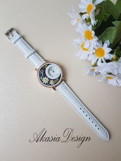 Imagine this pretty "Personalized Embroidered White Wrist Watch" on you/lovely friend/mother which is made with love and passion!  This personalized handmade embroidered women floral watch with 6 alternative design of tiny flowers and leaves: - Hand-stitched by a technique called "Brazilian embroidery". Each little detail is crafted individually by hand using a tiny needle. - Has measurement of approx.: 1.6 Inches (4cm) dia.    - Made of gold stainless steel and glass frame with a white faux lea Hand Stitched Embroidery, Wrist Watch For Women, Alternative Design, Floral Watches, Handmade Baby Shower Gift, Flower Watch, Brazilian Embroidery, Bridesmaid Accessories, Graduation Gifts For Her