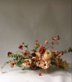 a bunch of flowers that are sitting on a table