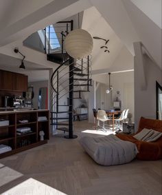 a spiral staircase in the middle of a living room