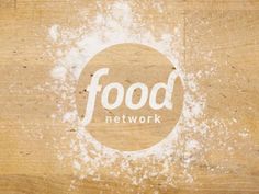 the food network logo is shown on a piece of wood that has been stained white