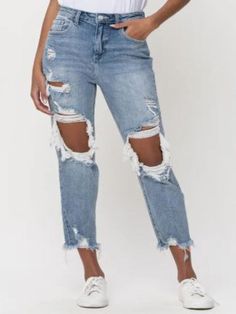 For those who like to keep it fun and casual, the Cello Light Denim High Rise Crop Jean is the perfect addition to your wardrobe. With a trendy high rise fit and a cropped, distressed design, these jeans are sure to add a playful edge to any outfit. Embrace your unique style with these quirky and comfortable jeans. Cotton and Spandex Blend Material. Hand Wash Cold. Fit Guide: We suggest sizing up 1 size in these! Ripped Straight Leg Jeans Outfits, Ripped Straight Leg Jeans, Ripped Mom Jeans, Comfortable Jeans, Summer Denim, Mid Rise Jeans, Light Denim, Business Fashion, Ripped Jean