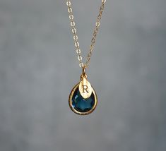 "This beautiful simulated sapphire necklace would be a perfect September birthstone birthday gift or one for or a wedding, anniversary, graduation, or for any occasion. The silver, gold-plated, or rose gold sapphire teardrop-shaped pendant is made of glass and shines beautifully in the light. It measures approximately 12.5x16mm and is hung on a 16\", 18\" or 20\" chain. The chain options include silver-plated, gold-plated, rose gold-plated, sterling silver, 14K gold-filled, or 14K rose gold-filled metal. The chains are dainty and very pretty - the perfect delicate necklace for everyday wear. The silver, rose gold or gold-plated leaf charm is approximately .25 inches and is subtly stamped with an initial. The necklace can be purchased without the leaf or you can add up to 3. Please include Elegant Teardrop Birthstone Necklace Gift, Personalized Teardrop Birthstone Necklace For Anniversary, Elegant Drop Birthstone Necklace Gift, Blue Birthstone Necklace For May, Personalized Drop Jewelry For Anniversary, Teardrop Pendant Birthstone Necklace For Wedding, Gold Teardrop Birthstone Necklace For Anniversary, Teardrop Birthstone Necklace For Wedding, Blue May Birthstone Necklace As Gift