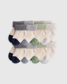 Wrap your little one in comfort from their head to their tiny toes. Crafted in our soft organic cotton, this 8-pack of socks was designed with an ultra-soft cushioned footbed and seamless toe to prevent irritation. Perfect for everyday wear - these classics will ensure your little one is putting their best foot forward.  | Quince | Organic Fold Over Socks 8-Pack Baby Boy in Navy/Light Blue/Green, Cotton Baby Socks Template, Baby Boy Socks, Goose Down Pillows, Newborn Boy Clothes, Baby Boy Accessories, Kids Room Wall Decor, Muslin Swaddling, Light Blue Green, Linen Duvet Covers