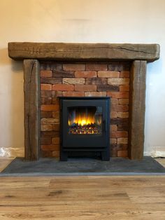 a wood burning fireplace in a living room