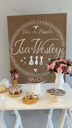 a white table topped with cakes and desserts