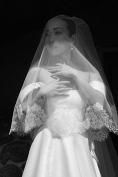 a woman in a wedding dress and veil