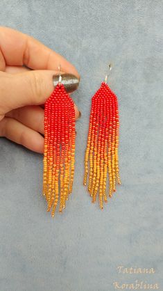 These handmade earrings are made of high-quality Czech beads and strong synthetic thread. They are elegant, fashionable, and highly versatile, suitable for everyday wear. Color: red, orange. There may be some color discrepancies which is due to the different monitor settings 100% hand made with love! Measurements: Length-about 11cm (4.3 inch) Width -about 2 cm (0.79 inch) Materials: Sterling silver components Czech glass beads Strong bead weaving thread Red Tassel Earrings With Round Beads As Gift, Adjustable Red Handwoven Earrings, Handmade Red Tassel Earrings With Round Beads, Red Drop Tassel Earrings For Summer, Red Tassel Drop Earrings For Summer, Handmade Red Beaded Earrings For Summer, Handwoven Red Earrings, Orange Tassel Earrings With Colorful Beads As Gift, Gift Orange Beaded Tassel Earrings