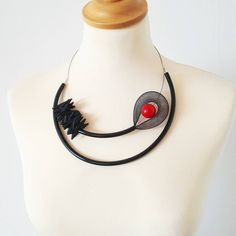 Gorgeous Avant-garde jewelry set (necklace and earrings), made of steel wire string cord, black plastic-rubber tubing, black nylon mesh tubing, black foam, and red plastic bead. A must have accessory to jazz up your wardrobe. Necklace length: 55 cm / 21.7 in Earrings length: 9 cm / 3.5 in Package will be shipped out as soon as I possibly can which is usually 3 - 5 business day after the purchase. Don't hesitate to contact me if you have any question.. Thanks for stopping by and don't forget to c Black Wire Wrapped Necklace For Party, Modern Black Necklaces For Parties, Modern Black Necklace For Party, Pearl Necklaces Modern, Avant Garde Jewelry, Popular Necklaces, Spiral Necklace, Mesh Necklace, Pearl Statement Necklace