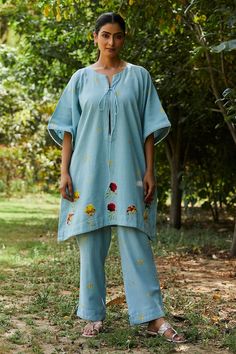 Blue kaftan with floral applique work and small embrodiered buttis. Paired with an embroidered pant. - Aza Fashions Festive Summer Tunic Sets, Summer Cotton Tunic Sets, Festive Floral Embroidered Tunic Set, Blue Sets With Embroidered Border For Spring, Bohemian Blue Set With Floral Embroidery, Bohemian Blue Sets With Floral Embroidery, Summer Straight Kurta Pant Set With Resham Embroidery, Traditional Embroidered Straight Kurta Bottoms, Traditional Summer Palazzo Set With Straight Pants