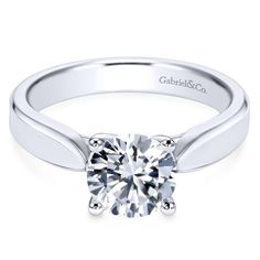 a white gold engagement ring with a round brilliant diamond