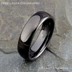 an image of a black wedding ring with free laser engraving