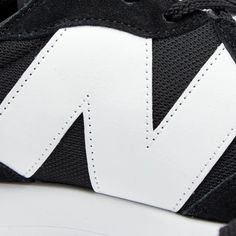 Synonymous to the aesthetic of classic 70s runners, Boston-based sneaker brand New Balance offers up its coveted 327 sneakers, this time, with jet black suede uppers with a sporty mesh base. The iconic asymmetric ‘N’ features in contrasting white at the sidewall, while underfoot, the classic trail-inspired lug outsole wraps around the back for an all-around stand-out finish..Mesh Uppers.Pigskin Suede Overlays.EVA Midsole.Rubber Outsole Modern New Balance Sneakers With Vulcanized Sole, Modern Leather New Balance Running Shoes, Modern New Balance Running Shoes With White Sole, Black New Balance Sneakers With Vulcanized Sole, Modern Black New Balance Running Shoes, Balance Sneakers, New Balance Sneakers, Mens Sportswear, Sneaker Brands