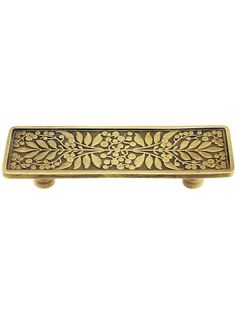 an ornate brass door handle on a white background