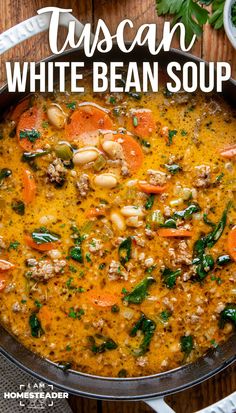 tuscann white bean soup in a skillet on a wooden table