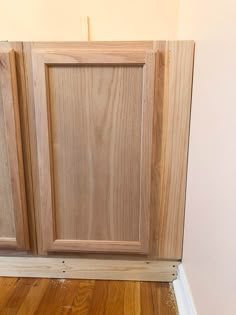 an unfinished cabinet door is sitting on the floor