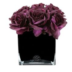 a black square vase with purple flowers in it