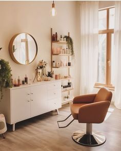 a living room filled with furniture and a mirror on the wall next to a window