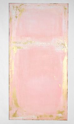 a pink and gold painting on a white wall