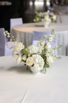 Floral compote arrangement made with all white flowers and placed on the guest tables Small White Arrangement, Small Flower Wedding Centerpieces, White Low Centerpiece Wedding, All White Arrangements, Small Compote Floral Arrangement, Small Floral Centrepiece, Low Table Arrangements Wedding