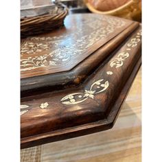 a wooden table with ornate designs on it