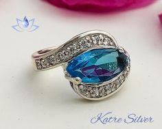 Excited to share the latest addition to my #etsy shop: Marquise Cut Halo Engagement Swiss Blue Topaz Ring, Marquise Ring, Halo Ring, Anniversary Ring, Birthstone Ring, Gift for Her https://etsy.me/3MC6hNK #silver #no #topaz #blue #women #artdeco #oval #yes #swissblueto Mystic Topaz Jewelry, Swiss Blue Topaz Ring, Mystic Topaz Ring, Red Stone Ring, Ring Marquise, Rainbow Rings, Womens Ring, Marquise Ring, Topaz Jewelry