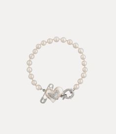 Pearls remain an essential element of the house’s iconography, evoking both a sense of luxury and rebellion. This season's Orietta Pearl bracelet features a row of glass-based Swarovski pearls, adorned with the iconic asymmetric heart motif and an orb at the centre, embellished with a safety pin detail - a nod to Vivienne's punk-inspired, non-conformist aesthetic. Girly Wishlist, Vivienne Westwood Bracelet, Jewelry Vivienne Westwood, Coquette Core, Vivienne Westwood Jewellery, Wishlist 2024, Clothes Wishlist, Heart Motif, Cute Accessories