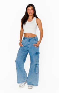 Equipped with plenty of pockets, these cargo jeans are made with wide legs and rigid denim for a relaxed, vintage-inspired look. Off-duty vibes paired with a white tank and sneakers. Bell Bottoms And Sweater, 2024 Clothes, Maternity Bridesmaid Dresses, Sparkle Skirt, Rainbow Outfit, Plus Size Swim, Romper And Jacket, Denim Pants Women, Gameday Outfit