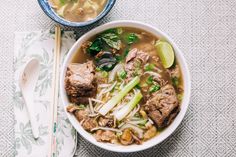 a bowl of soup with meat and vegetables